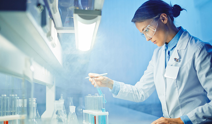 Photo of a female scientist working in a lab