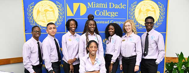 Student life members pose for a group picture with the Campus President