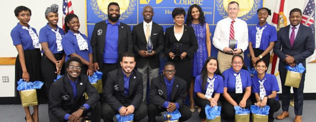 Student life members pose for a group picture with the Campus President