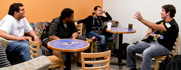 Students take a moment to relax from studying in the student lounge area