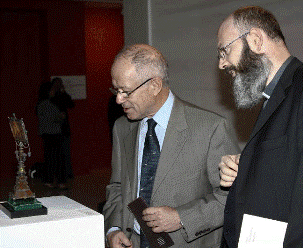 Two men look at artwork
