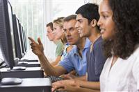 Students with teacher in computer lab