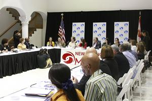 Panelists seated at tables