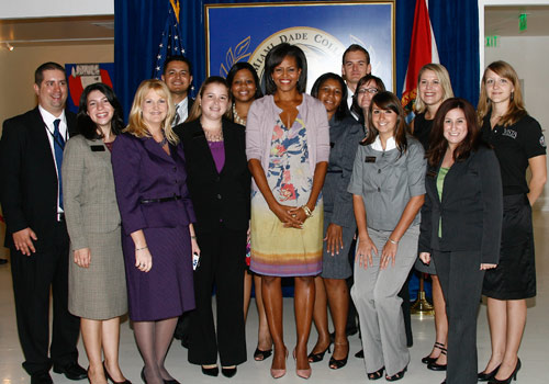 Michelle Obama surrounded by Campus Compact luncheon guests