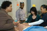 Nursing students receive instruction on a human patient simulator