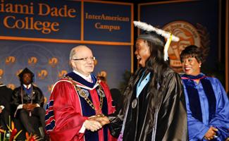 President Padrón congratulates student
