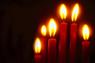 An array of lit candles