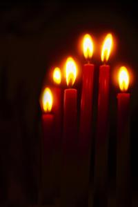 An array of lit candles