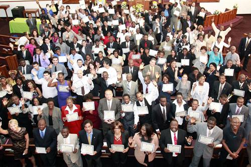 Program graduates holding certificates