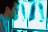 Technician reviews x-rays