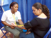 Student checks a patient's blood pressure