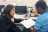 An MDC student tutoring a hearing impaired student