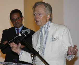 Tom Wolfe standing at podium