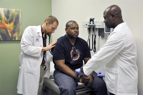 Dr. Thomas Schlepko, patient Clifford Silver and MDC nursing student Franky Louis