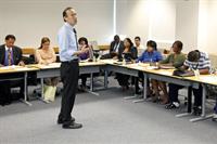Workshop attendees listen to presentation