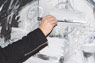 A viewer paints on one of González-Trejo's artworks.
