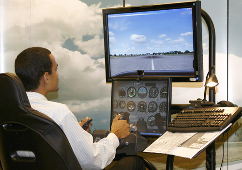 A student on a flight simulator