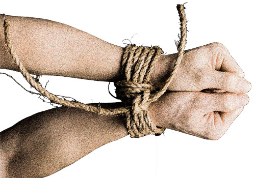 Arms and fists bound together by a rope.