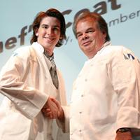 Student shaking hands with Chef John Richards