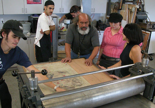 Professor Alberto Meza working with students
