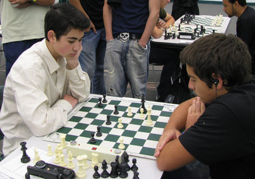 Two high school students concentrate during a tournament match.