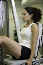 Girl using exercise equipment Girl using exercise equipment