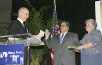 Three people at a podium