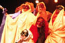 Prometeo students dressed in colorful costumes