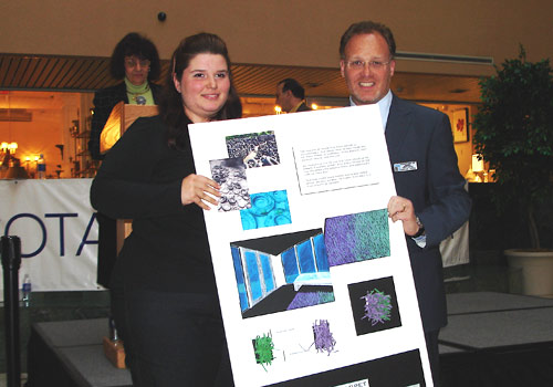 Eva Maria Pinero and an officer of the South Florida Chapter of the American Society of Interior Designers