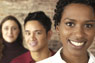 Three students smiling