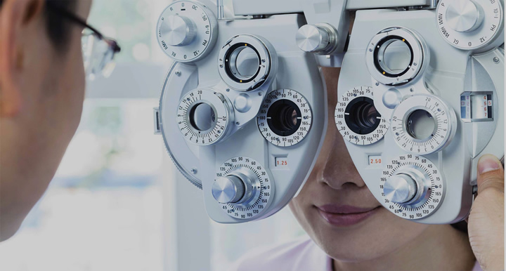 A woman receives an eye exam