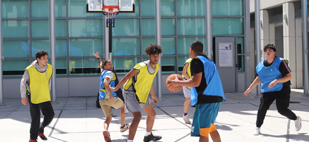 Students playing basketball at Padron Campus