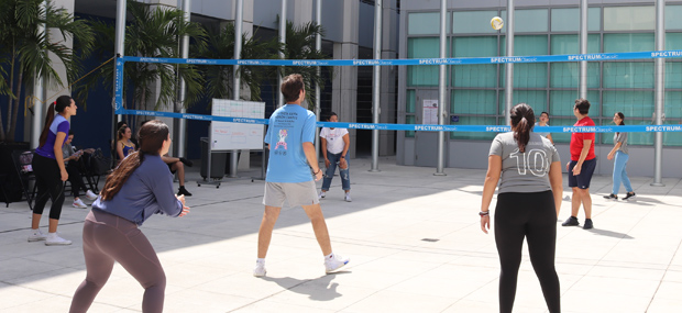 Students playing volleyball at Padron Campus