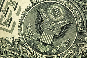 Close up of the eagle on the one dollar bill