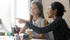 Female mentor assisting student