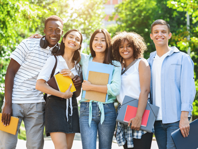 Group of college students smiling at the camera