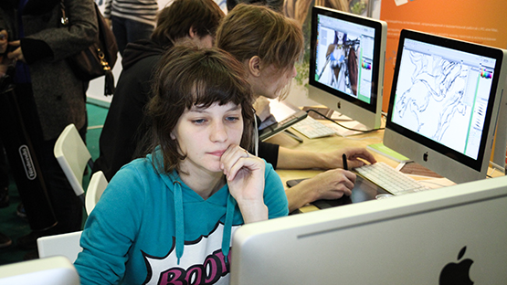 Students creating animation designs on computers
