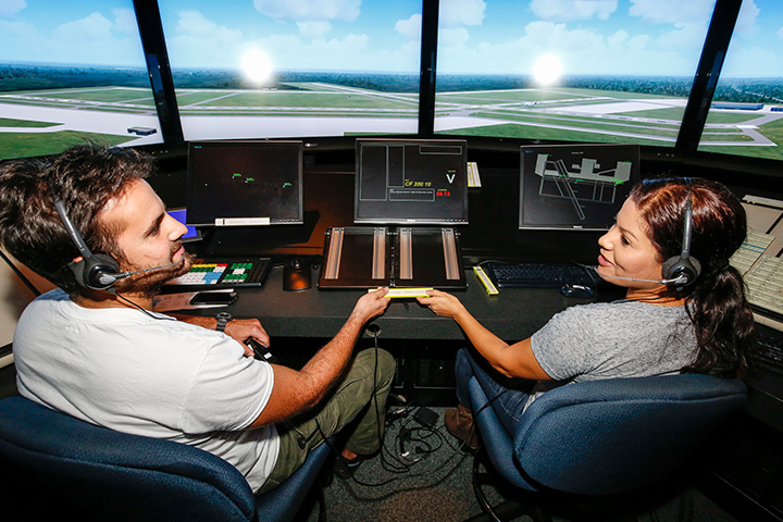 Two Miami Dade College students in a simulator