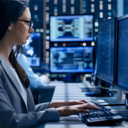 IT professional looking at the computer screen