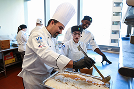 Miami Culinary Institute students and chef preparing a meal