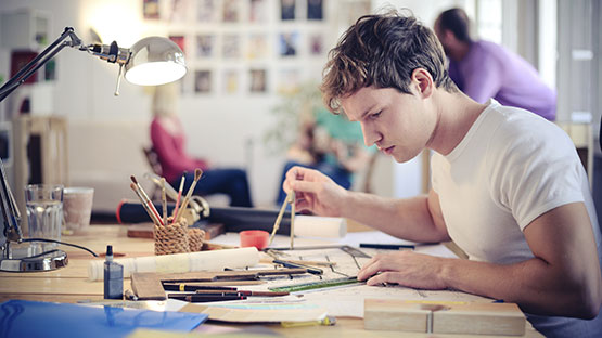 Student sitting and working at desk