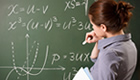 Teacher instructing students using her blackboard