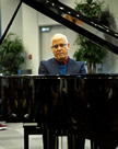 Dr. Sergio Gonzalez playing the piano