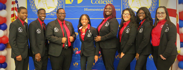 Student life members pose for a group picture with the Campus President