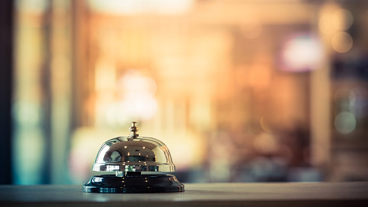 bell on top of hotel reception desk