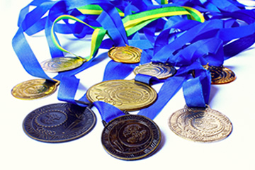 Collection of medals shown attached to colored ribon