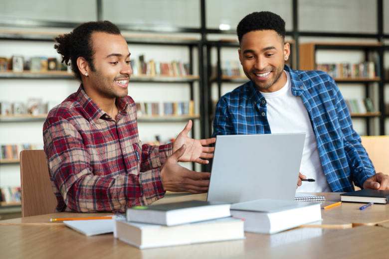 Two students working together on an assignment