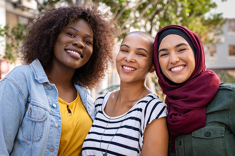 Group of three women smiling