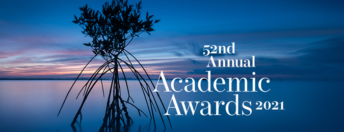 A mangrove photograph taken at dusk showing a dark blue sky with text outlining the 52nd Annual Academic Awards for 2021