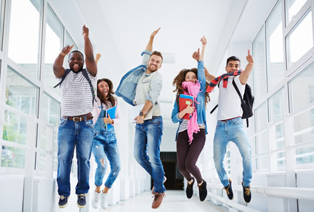 Group of students jumping in the air at the same time